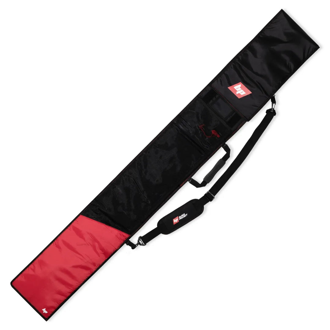 Studio image of the back of a Black Project SUP Paddle Bag, The bag is black and red with a white logo