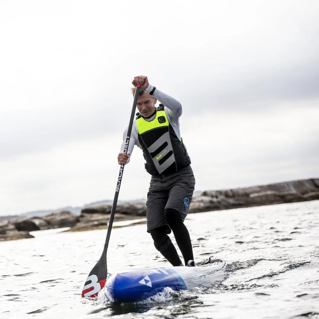 Baltic SUP Elite Buoyancy Aid UV Yellow On Male Paddleboarder Front View