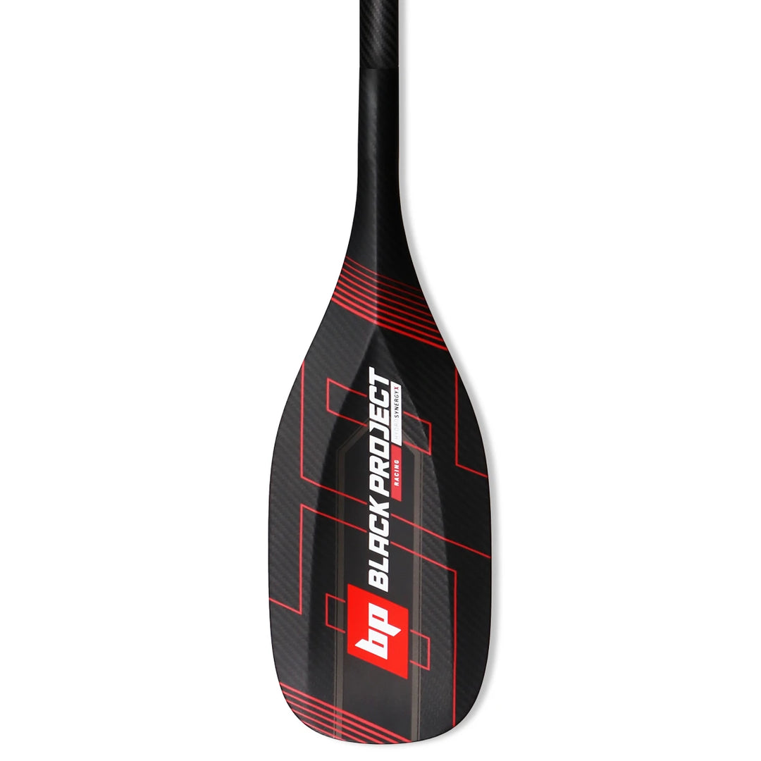 Studio image of a Black Project Hydro SynergyX Paddle Blade made from carbon fiber with red and white logos and red graphics.