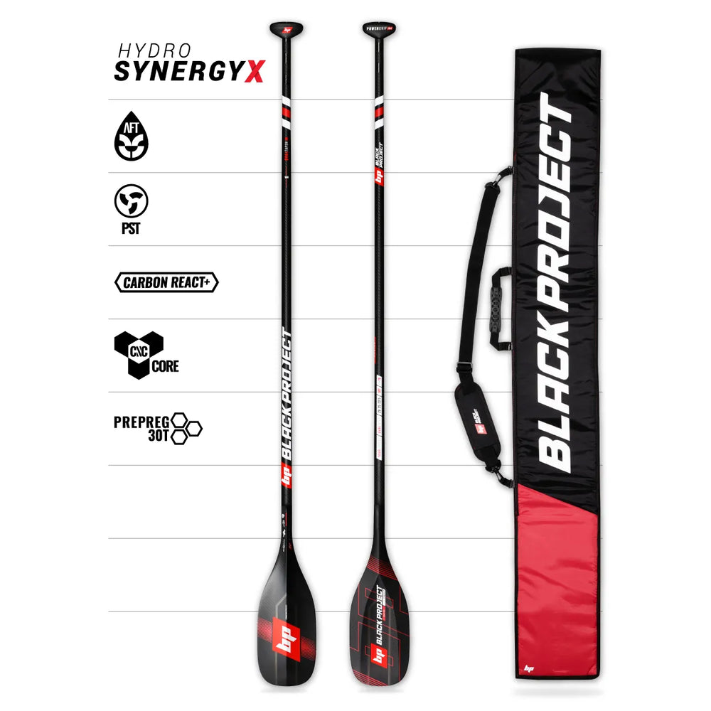 Studio image of a Black Project Hydro SynergyX Paddle Blade made from carbon fiber with red and white logos and red graphics. Image also shows the front and back of the paddle, along with a Black Project Paddle bag in black and red, and the construction technology logos.
