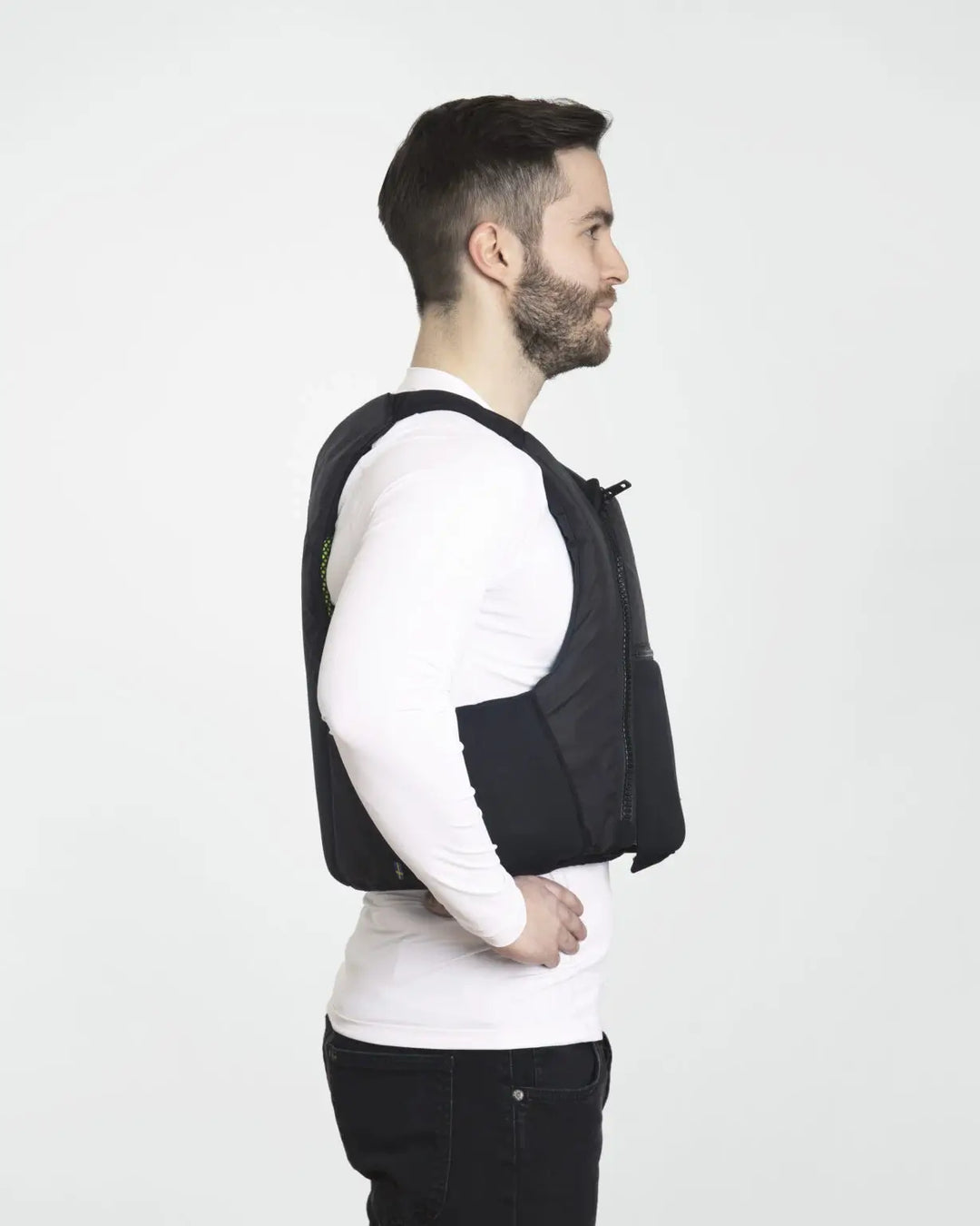 Baltic Extreme in black being worn by a male model in a studio. image from the side.