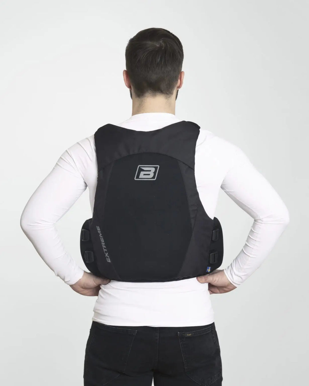 Baltic Extreme in black being worn by a male model in a studio. image from the back.