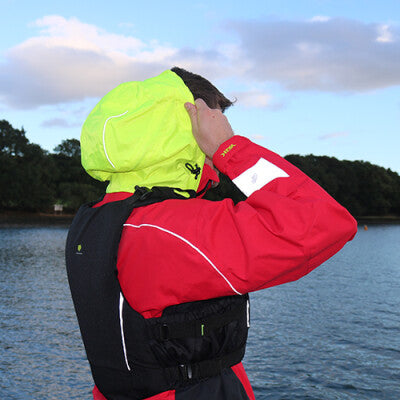 Male wearing a Yak Apollo dry top in red focusing on the hi-vis hood.