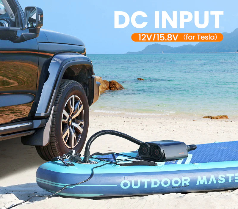 Inflatable SUP board pump with DC input adapter on a beach with a car in the background.