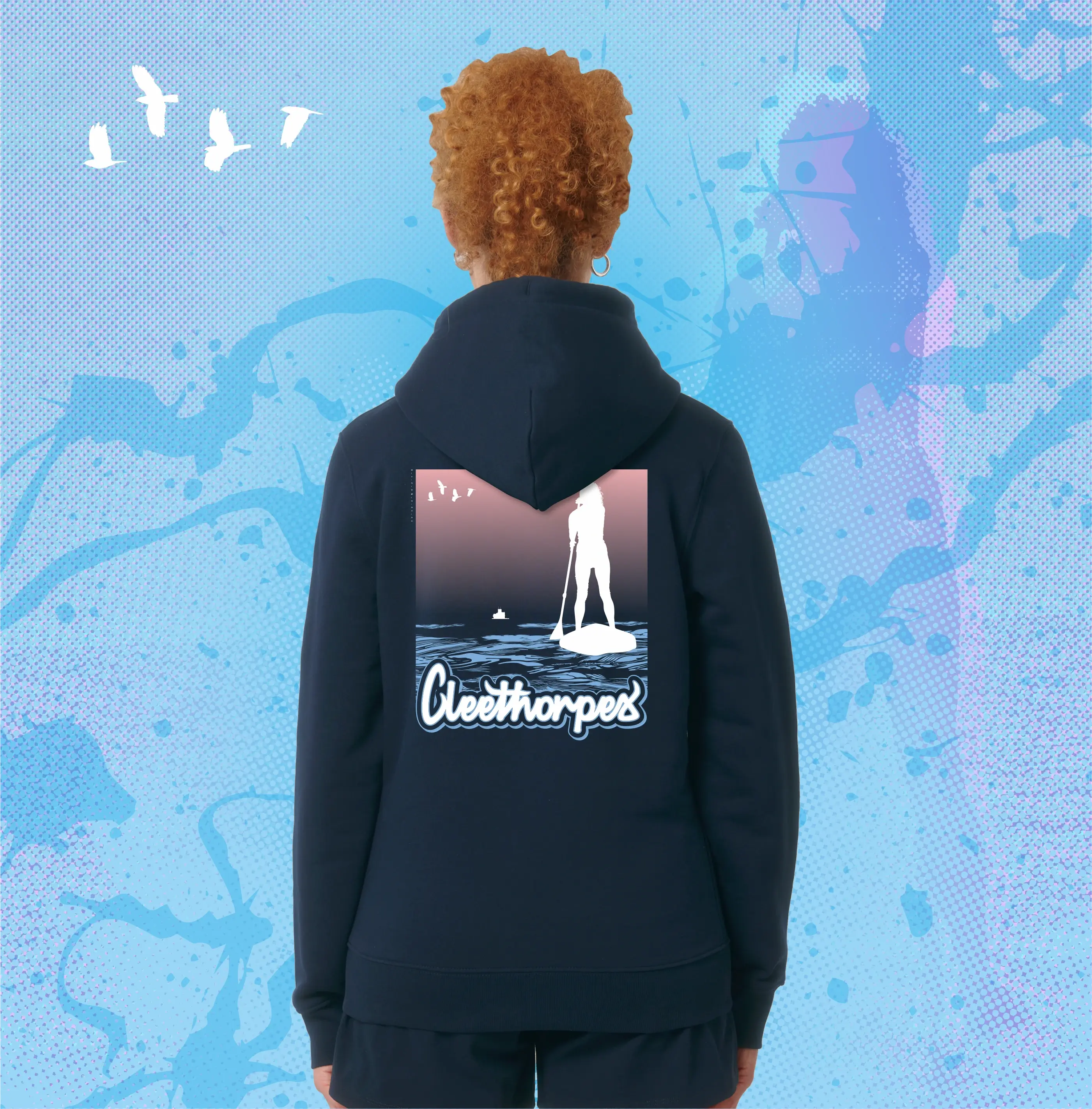 Person wearing a navy Cleethorpes hoodie with a Paddleboarding graphic design on the back against a blue abstract background.