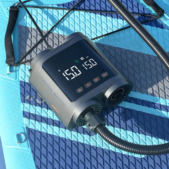Digital display on Vortex SUP pump with hose on a blue and grey textured deck pad.