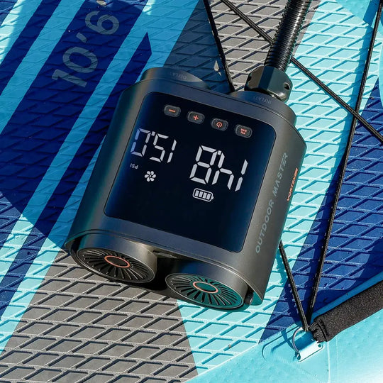 Outdoor Master Electric SUP pump in use on a blue iSUP.