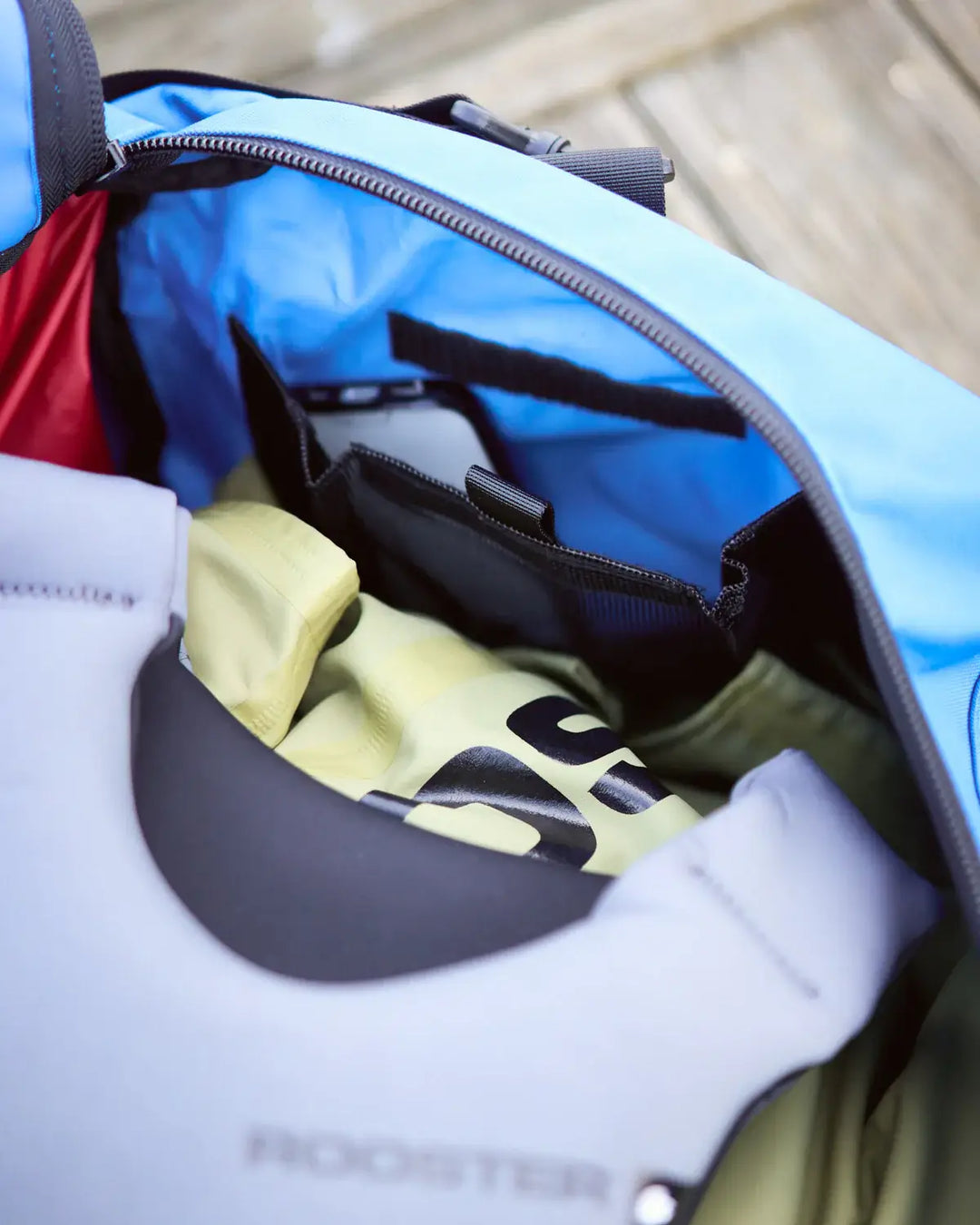 Open bag with clothes inside, featuring a visible brand logo.