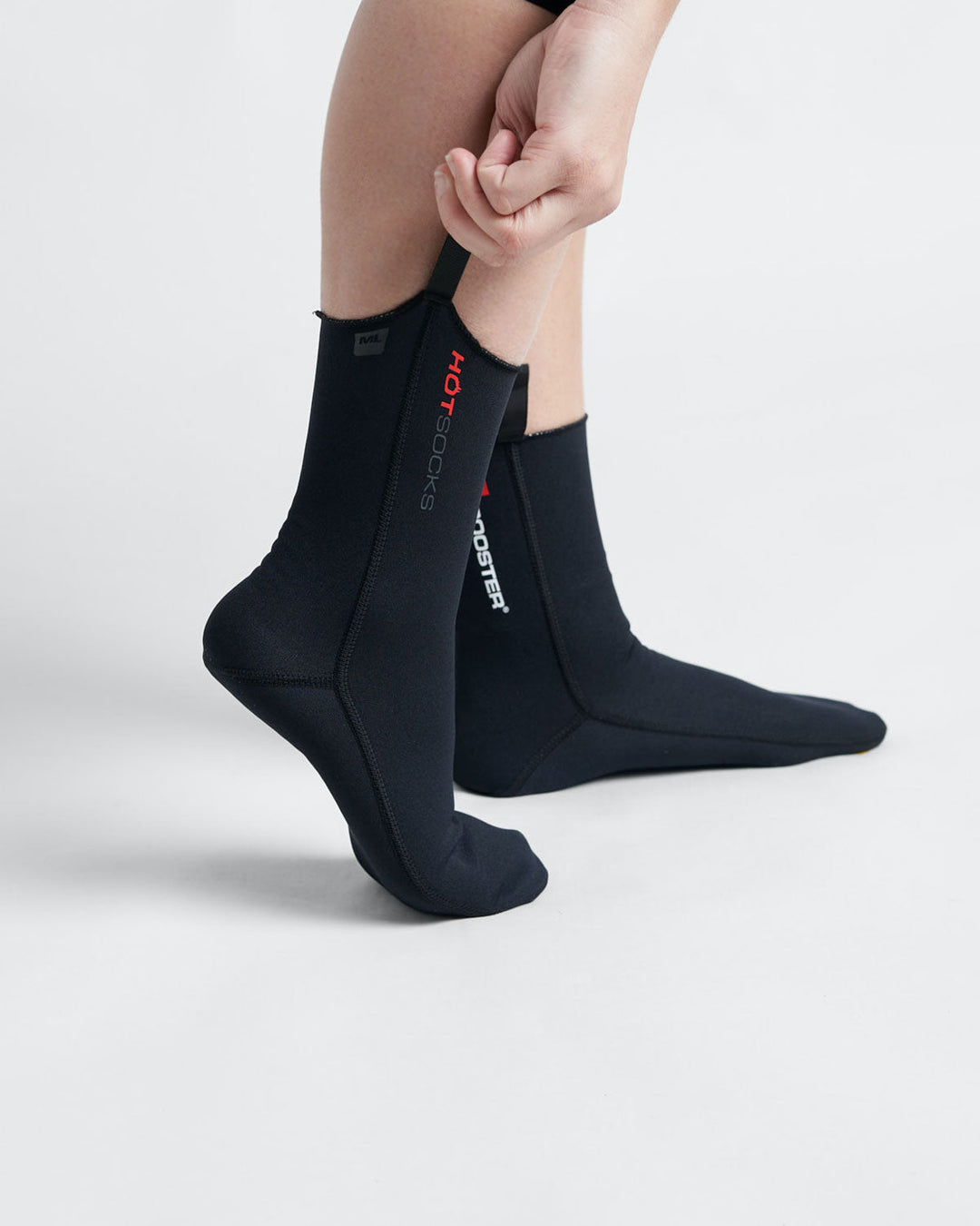 Black neoprene Rooster Hot socks with a red and white rooster logo, designed for water activities.