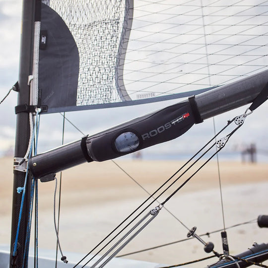 Rooster neoprene water bottle holder on the boom of a sailing dinghy.