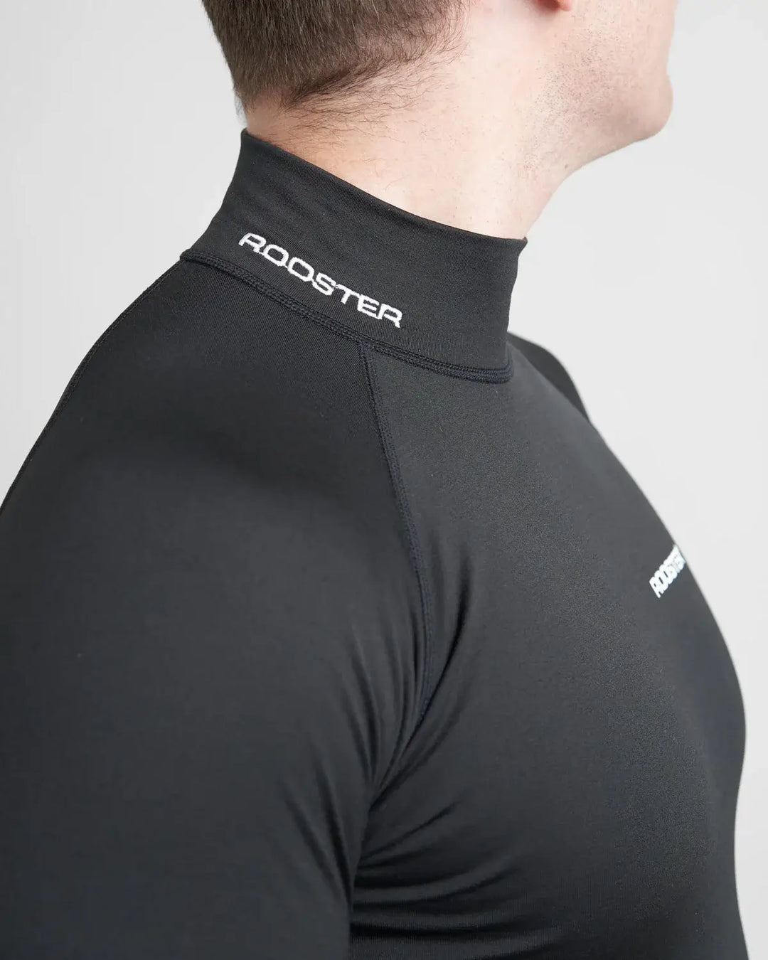 Black high-neck base layer with 'Rooster' branding on a white background.