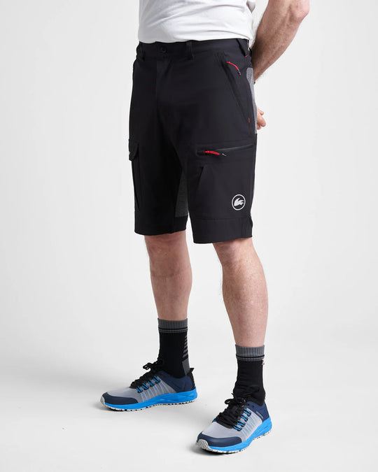 Studio image of a model wearing the black Rooster Technical Shorts 2.0 with a white background.