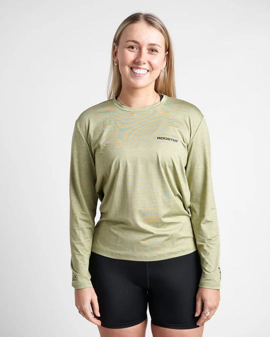 Woman wearing a green long-sleeve quick dry t-shirt with a logo on a white background.