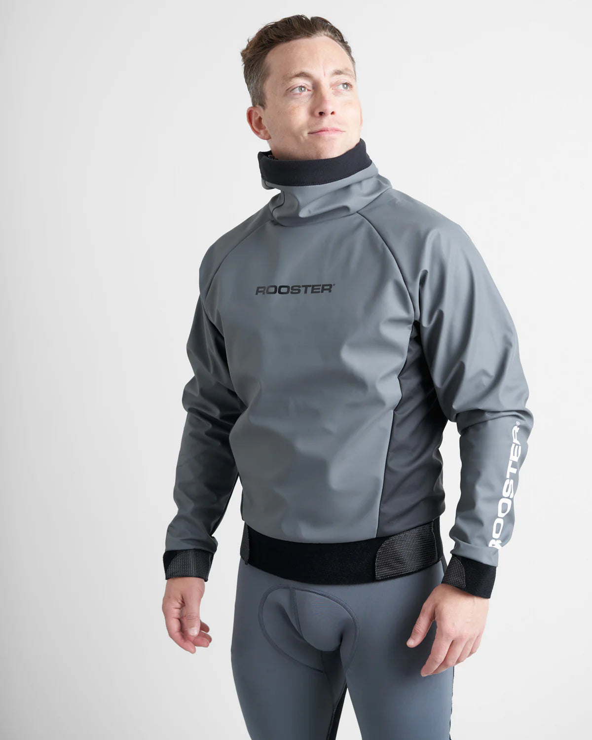 Person wearing a grey Rooster Aquafleece and wetsuit with 'Rooster' branding on a white background.