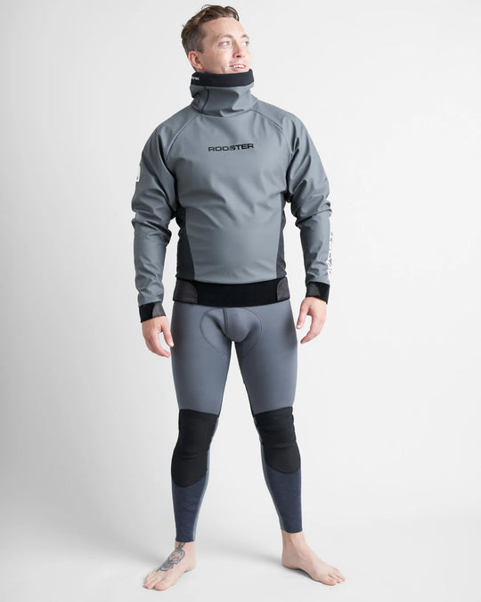 Person wearing a grey wetsuit with a grey Rooster Aquafleece Pro Lire top of it with black accents on a white background.