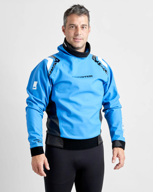 Man wearing a blue and black Rooster sailing spray top on a light grey background.