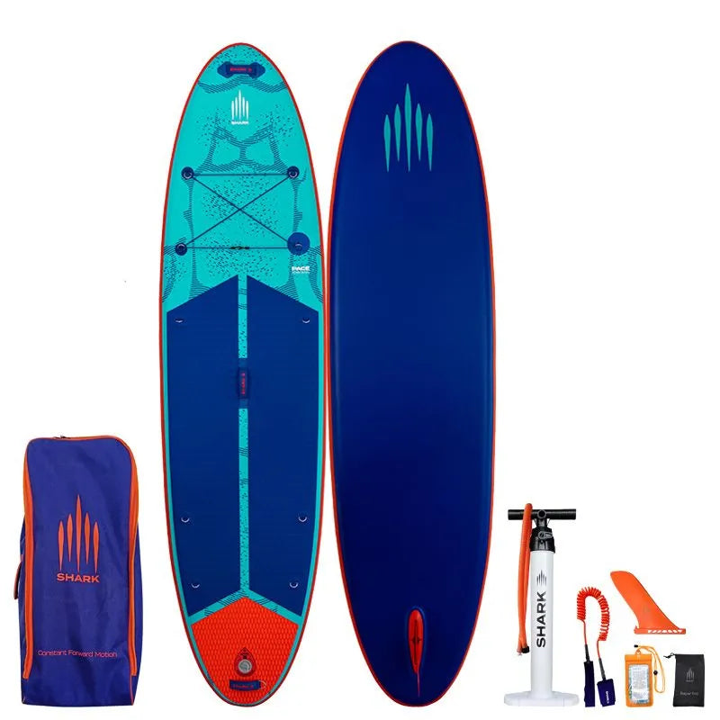 Image of Shark SUPS Pace 10'6 x 32" x 5" inflatable paddle board with light blue deck featuring shark skin graphics and a dark blue bottom. Also showing package accessories.