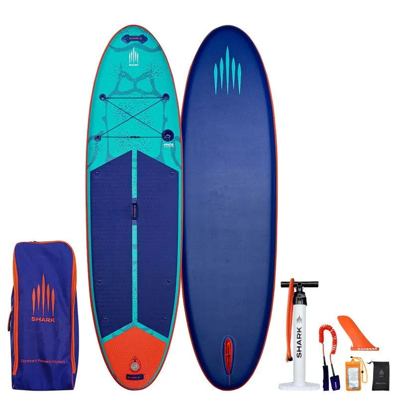 Image of Shark SUPS Pace 10'6 x 34" x 6" inflatable paddle board with light blue deck featuring shark skin graphics and a dark blue bottom. Also showing package accessories.
