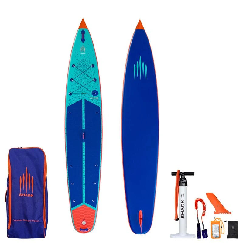 Image of Shark SUPS Venture Flow 12'6 x 30" x 6" inflatable paddle board with light blue deck featuring shark skin graphics and a dark blue bottom. Also showing package accessories.